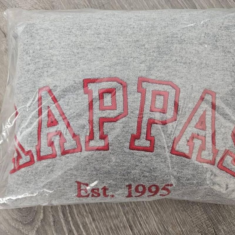 Customer photo: gray sweatshirt with red arched varsity embroidery and Est. 1995