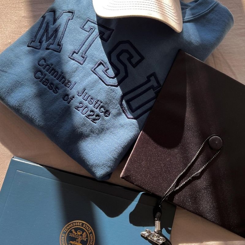 Customer photo: blue sweatshirt embroidered MTSU Criminal Justice Class of 2022 with a graduation cap