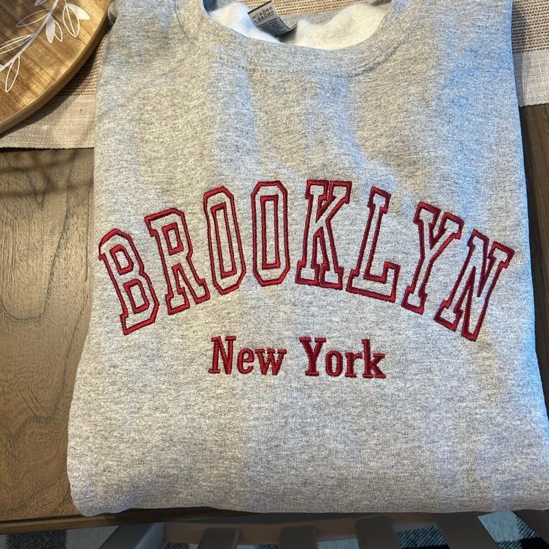 Customer photo: gray sweatshirt embroidered Brooklyn New York in red