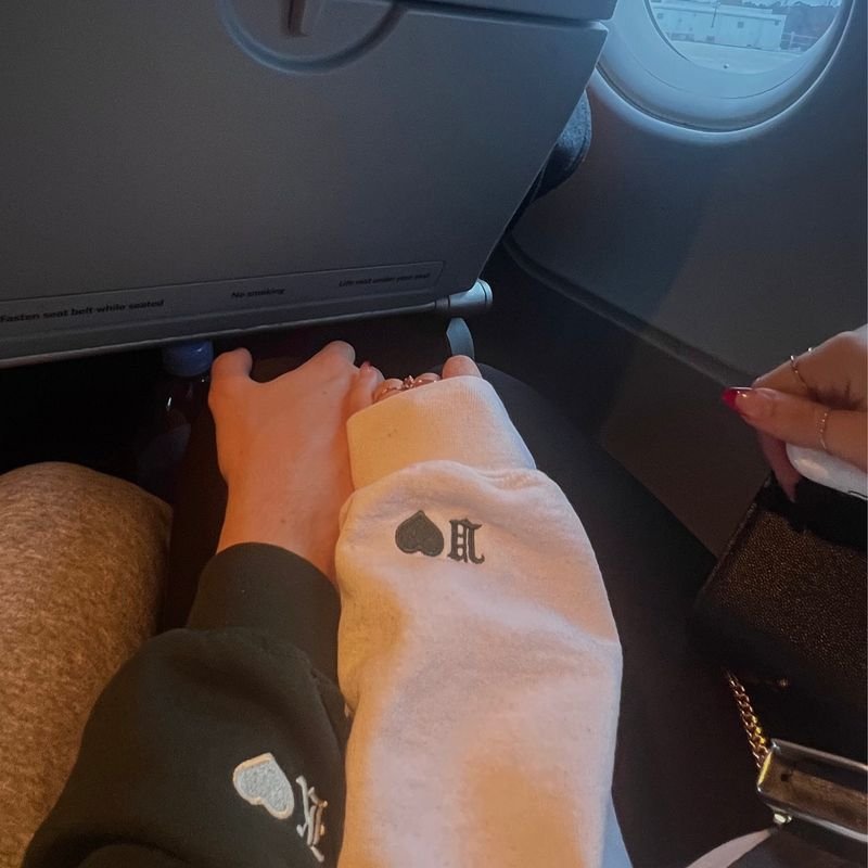 Customer photo: couple sweatshirt sleeves with heart and Old English initial embroidery
